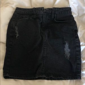 Distressed black denim skirt